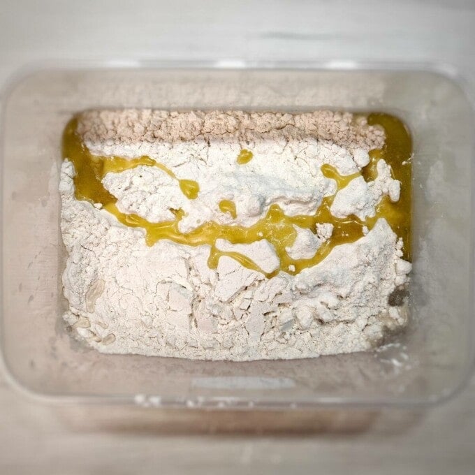 adding olive oil to flour mixture