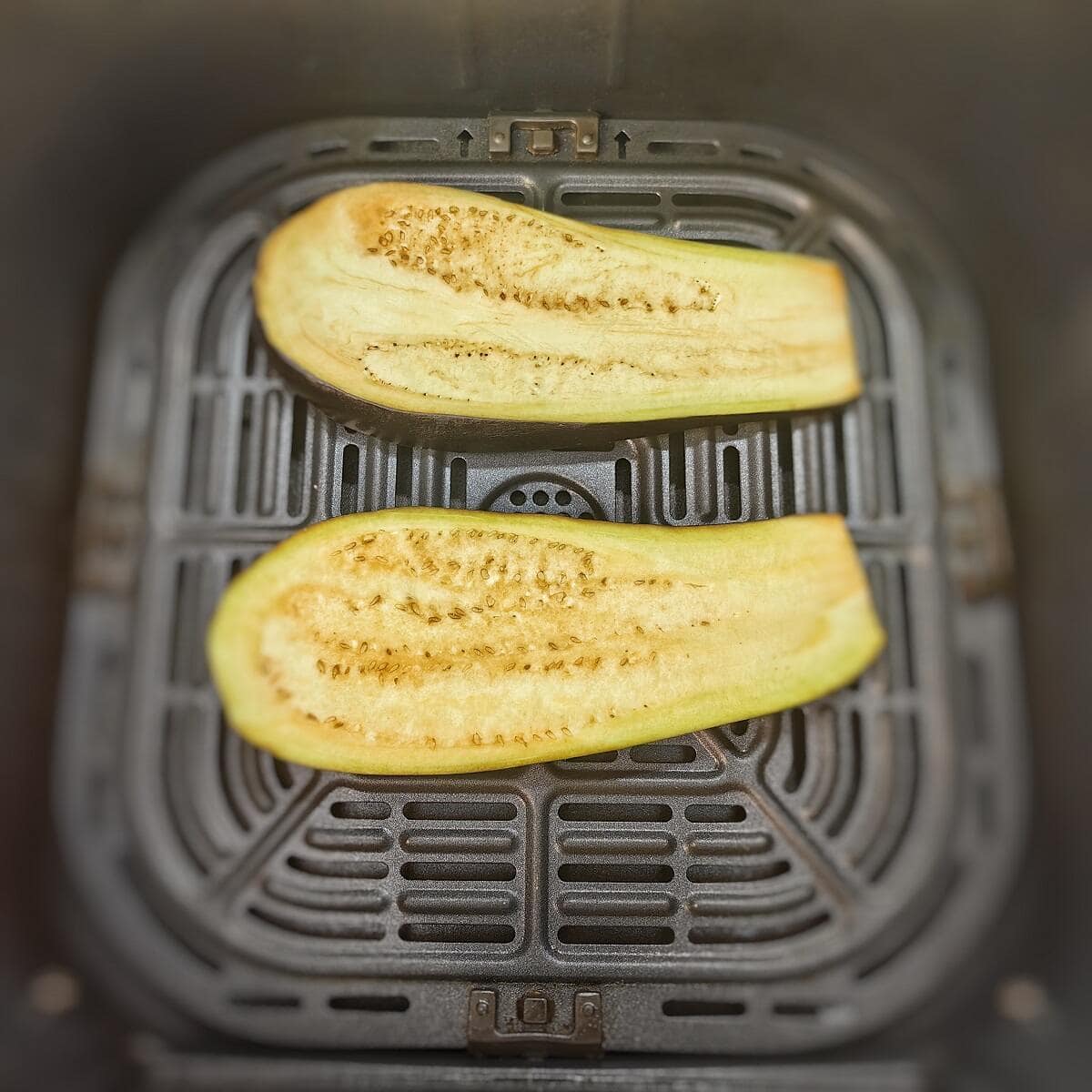 eggplant slices in air fryer basket