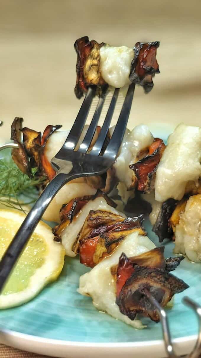 air fryer fish kebab on a serving dish and a fork