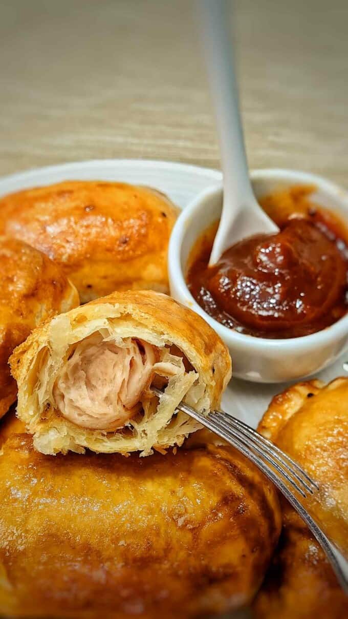 cross section of a sausage roll with bbq sauce