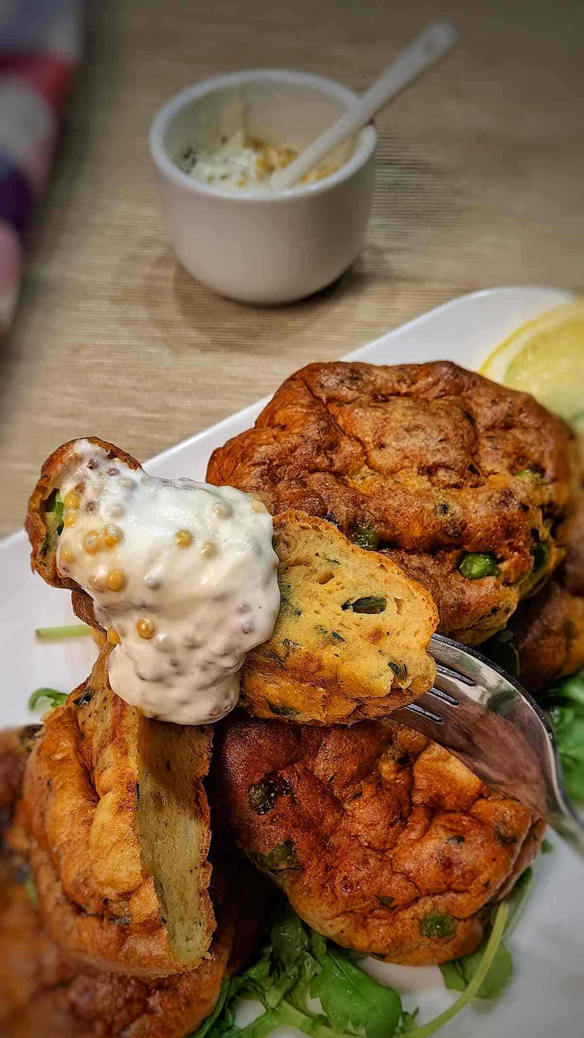 cross section of fish cakes with white sauce