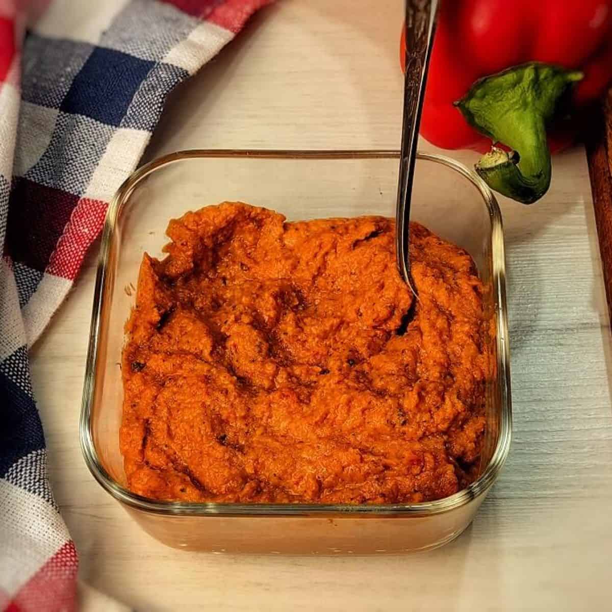 romesco sauce in a glass container
