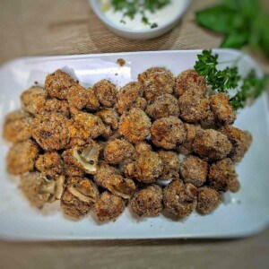 air fryer fried mushrooms on white serving dish