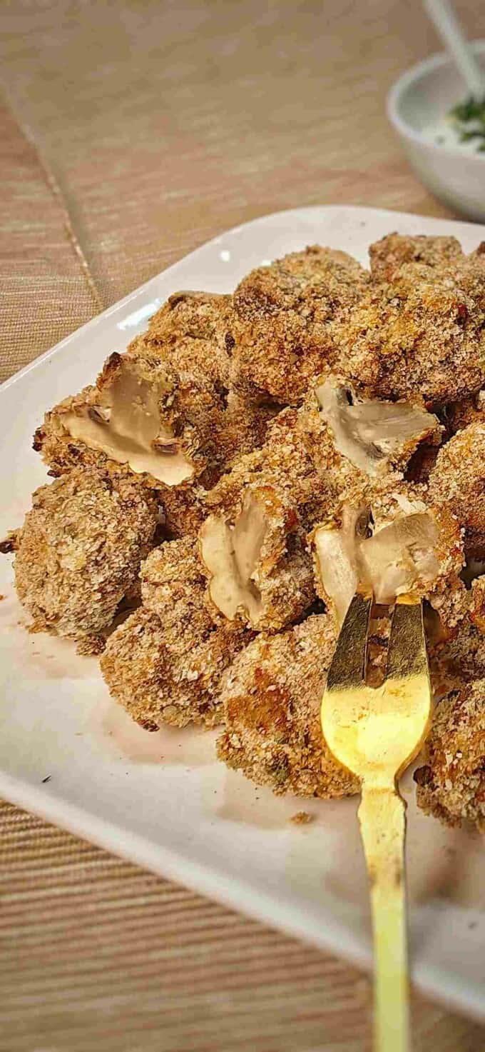 close up of air fried breaded mushrooms