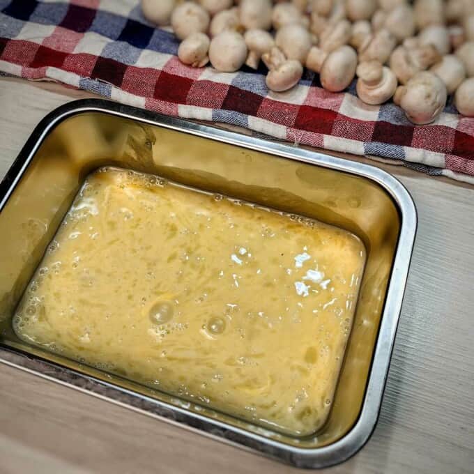beaten egg in metal container