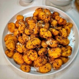 air fryer gnocchi on a white serving dish