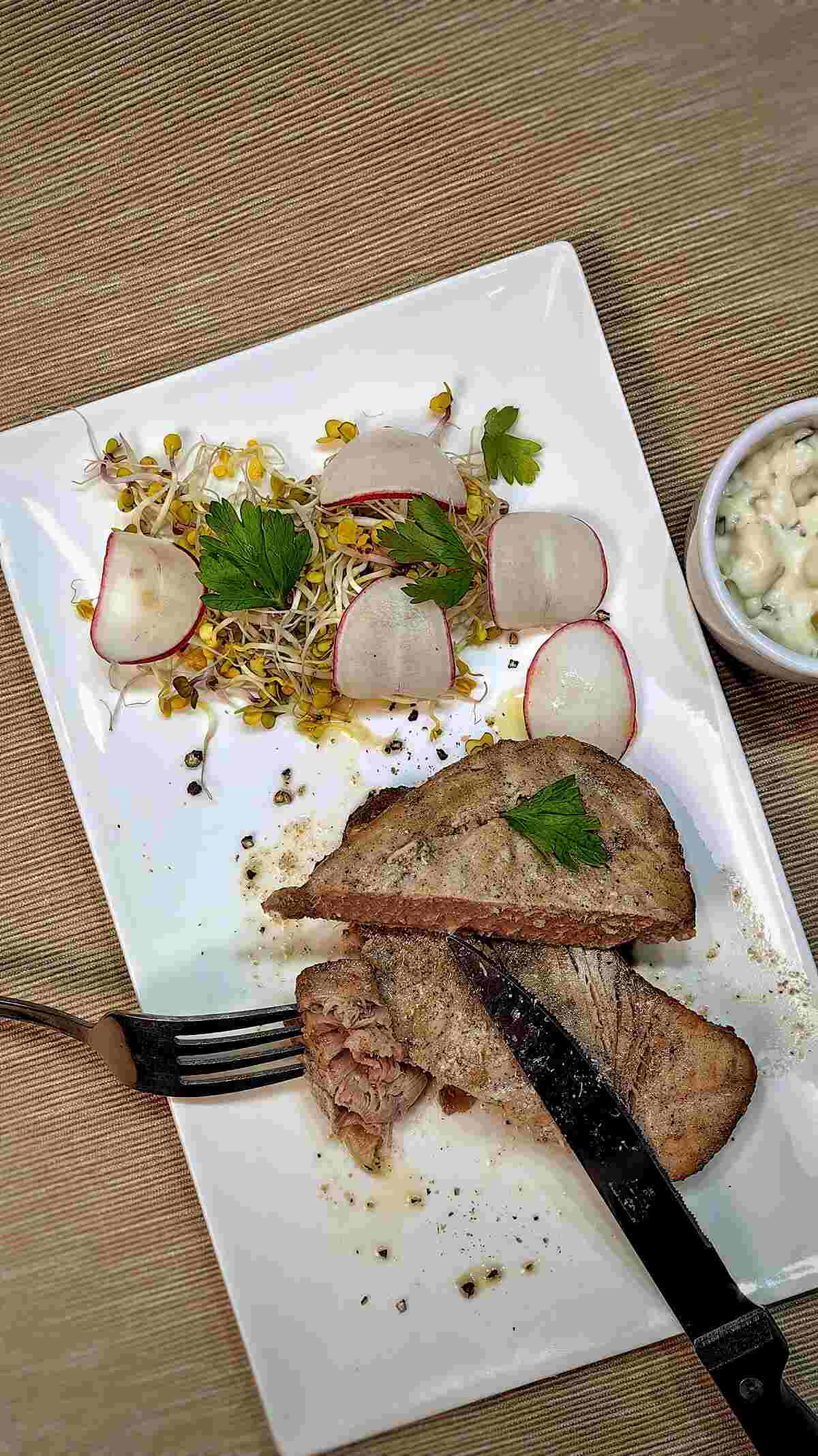 air fryer marinated tuna steaks on a white serving dish