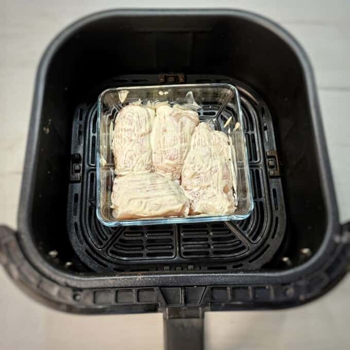 stuffed chicken breast roll-ups inside air fryer basket