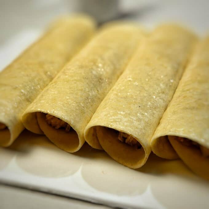rolled up taquitos brushed with oil