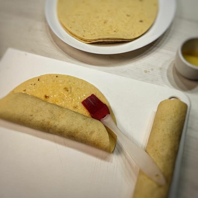 rolled tortilla with kitchen brush