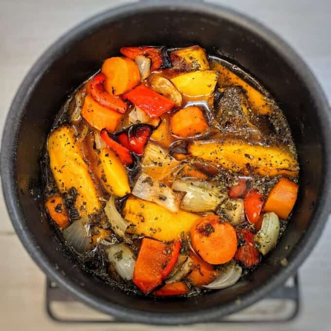 roasted vegetables with broth inside pot