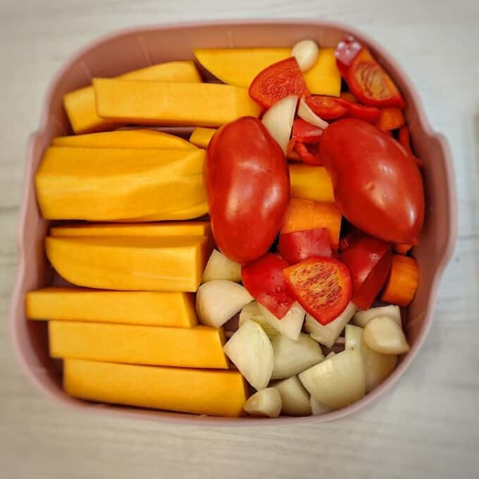 sliced vegetables in a silicone air fryer basket