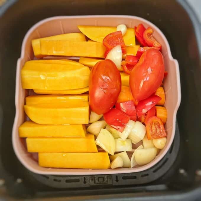 silicone mold with vegetables inside air fryer basket 