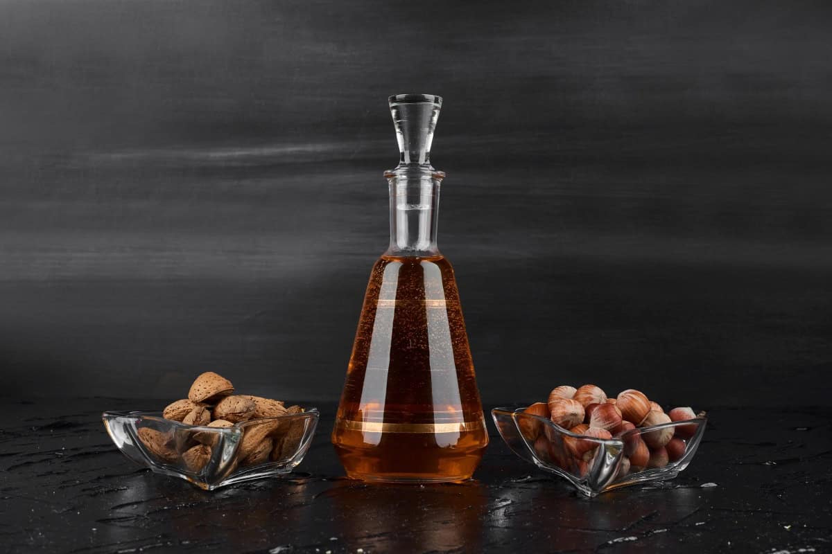 a bottle of almond liqueur with dry fruits