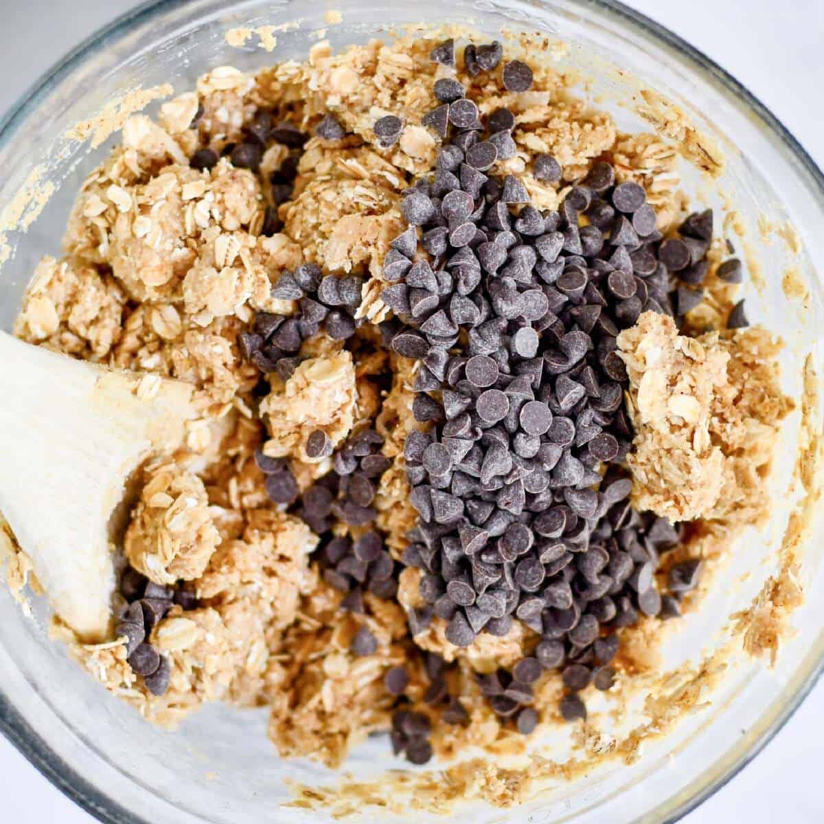 adding chocolate chips to the ingredients