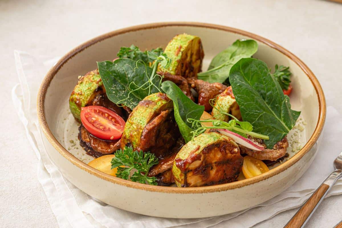 portion of gourmet warm salad with veal and zucchini