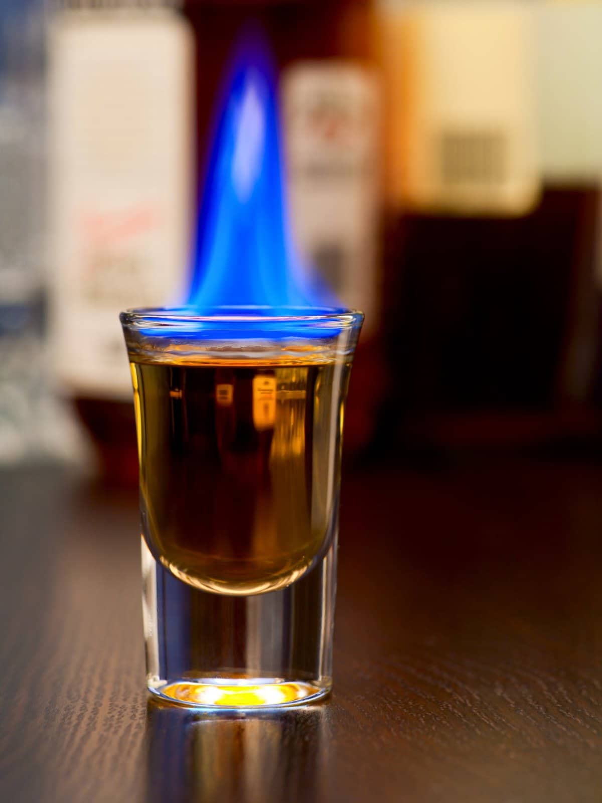 burning cocktail in shot glass