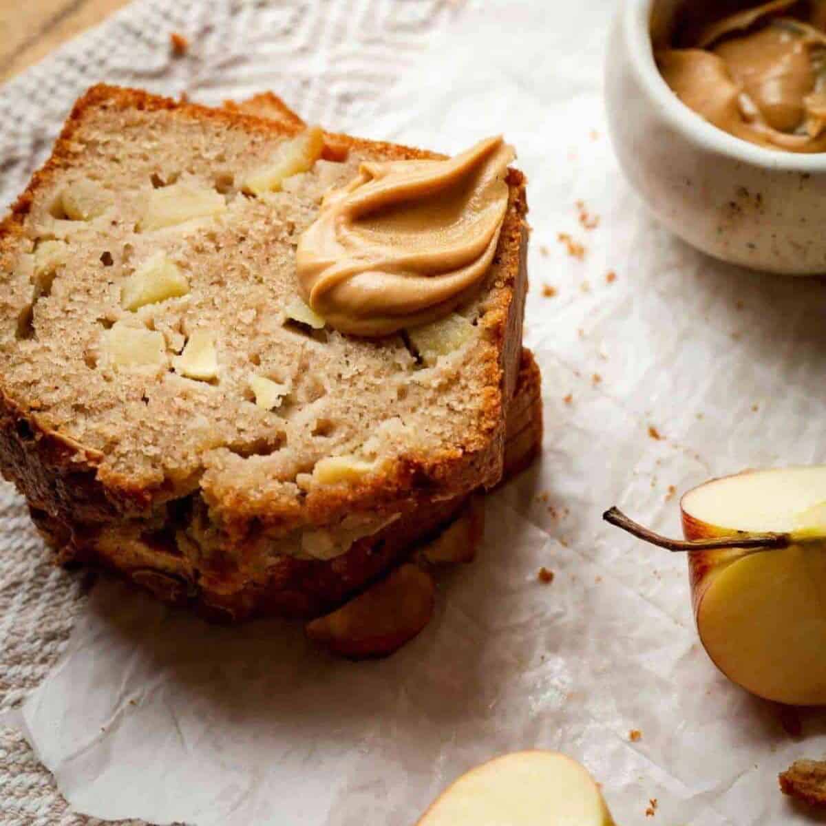 Cinnamon apple bread stacked on top of each toher with caramel sauce on top. 