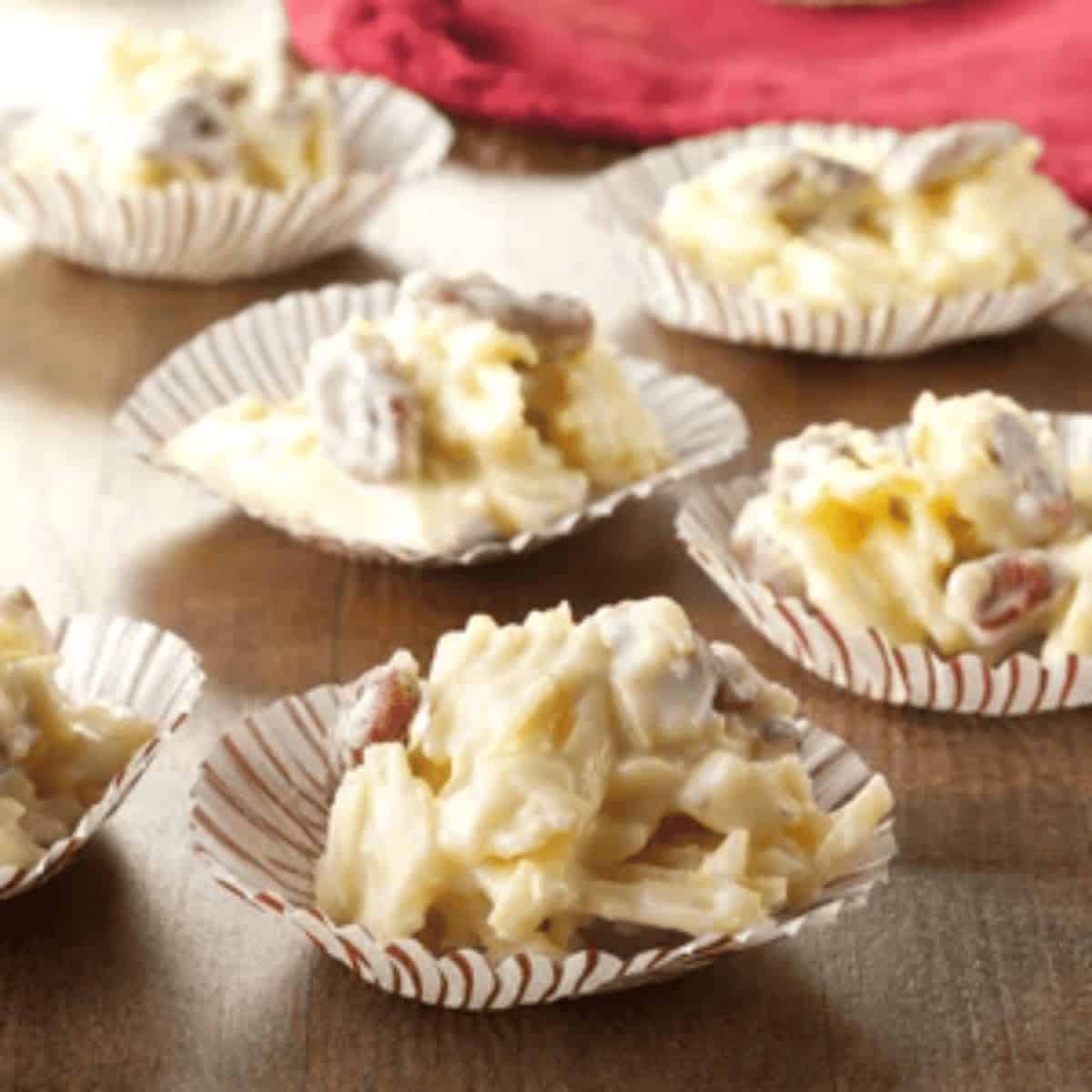 Crispy potato chip clusters, featuring a mix of ruffled chips held together with melted chocolate and pecan nuts.