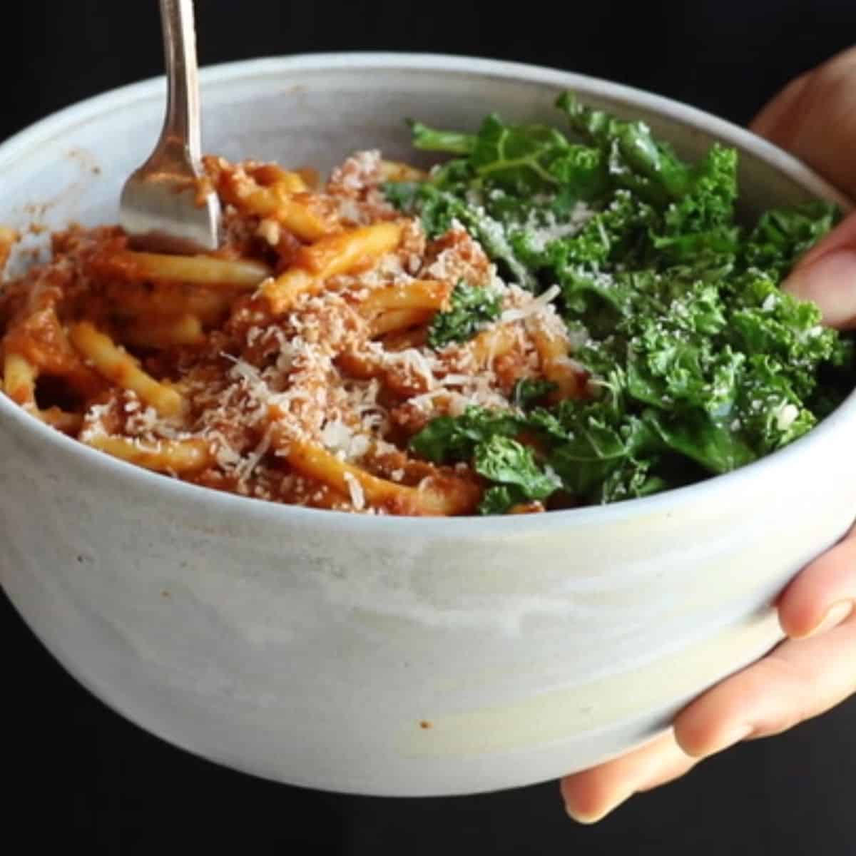 A yummy meal with pumpkin spaghetti and garlic kale.