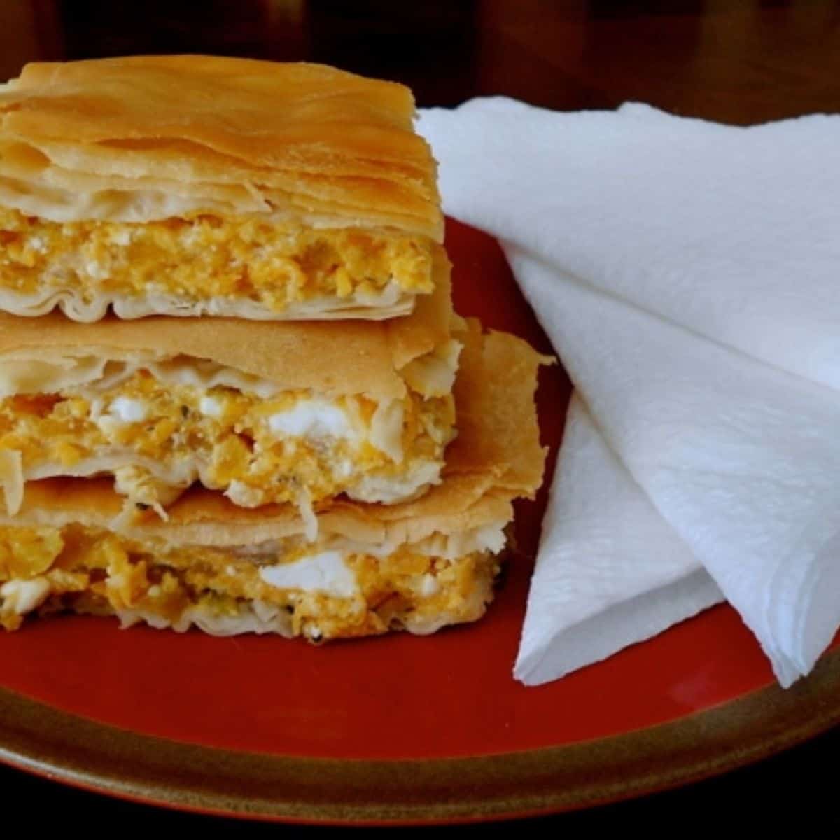 A savory meal featuring a Greek pumpkin pie that will satisfy your taste buds like none other.