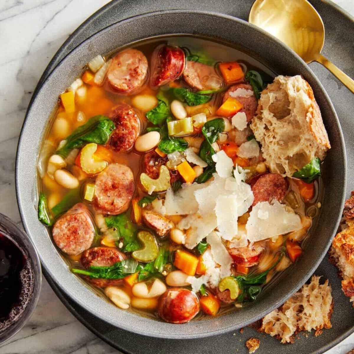 A yummy treat with slow cooker sausage, spinach, and white bean soup.