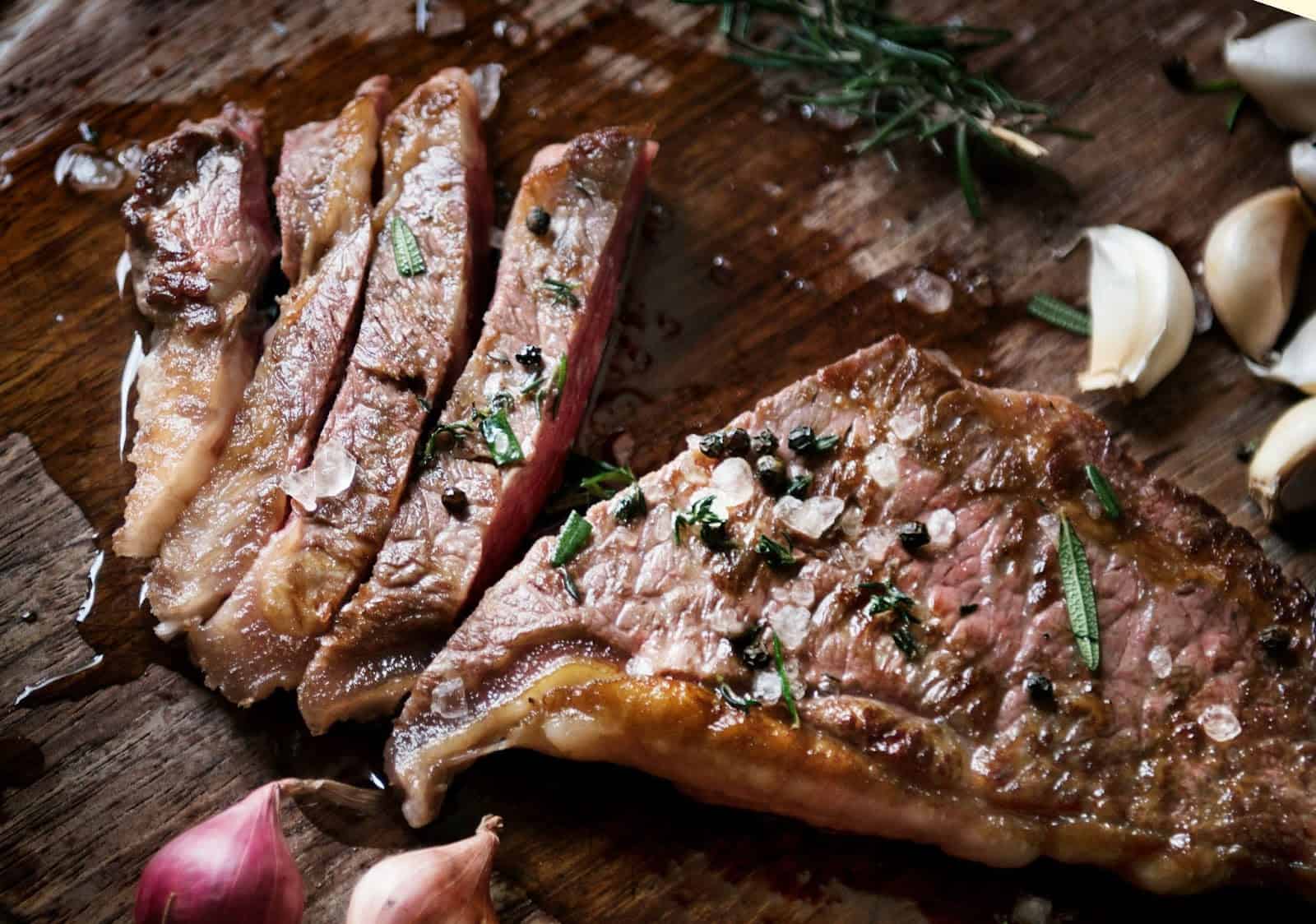 cook gourmet meals on a budget - Fried piece of steak with some spices