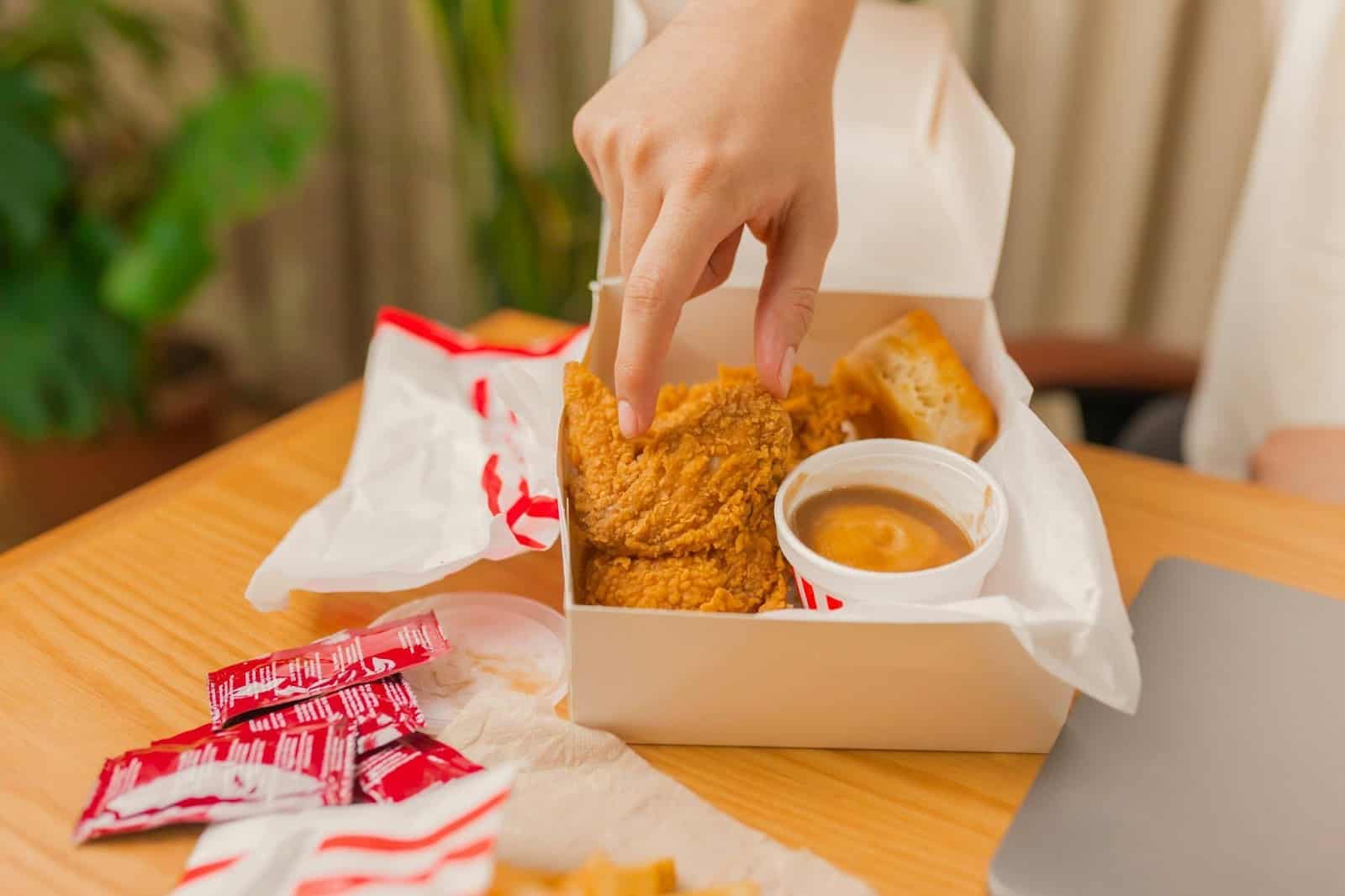 quick and healthy air fryer meals - chicken pieces that are crumbed set in a box with a dip