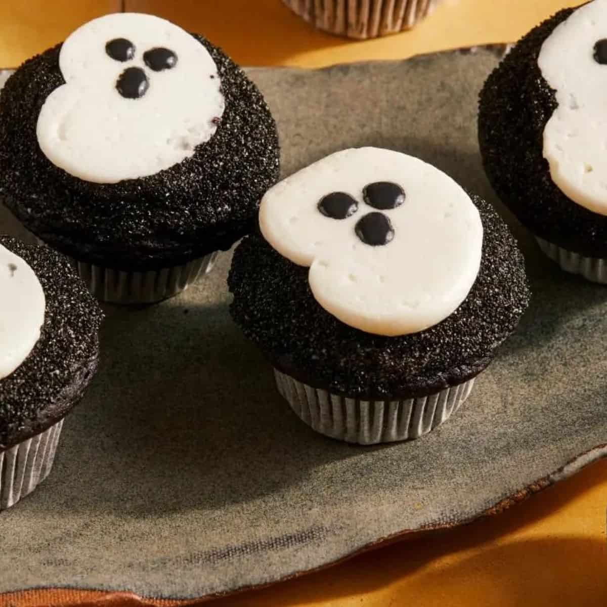 A delicious treat featuring black cocoa ghost cupcakes.