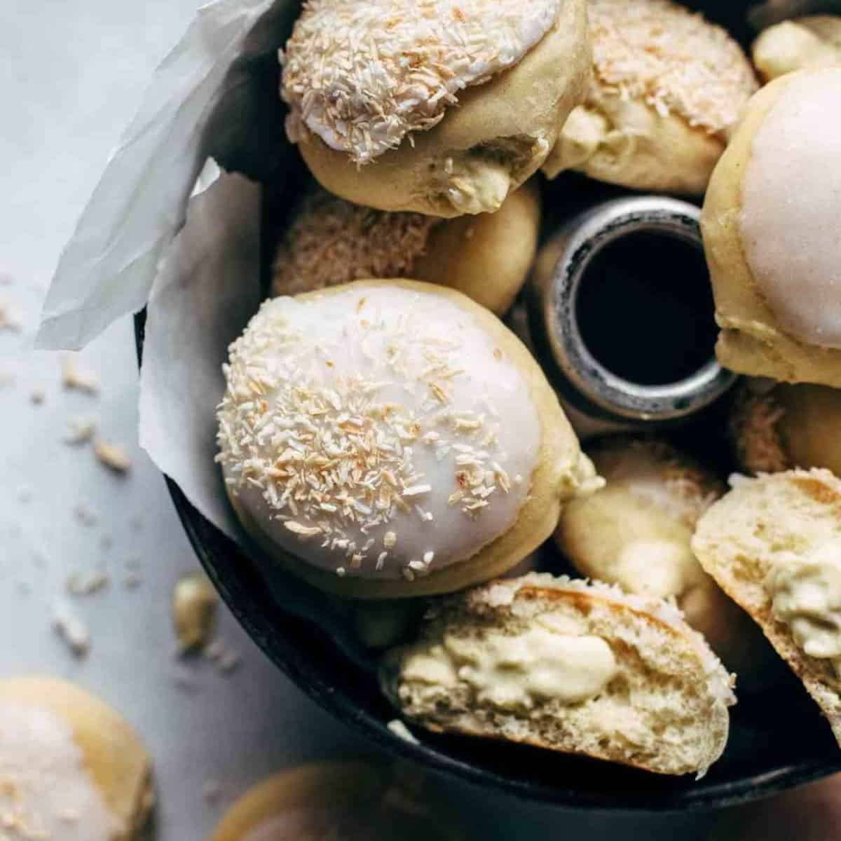 A yummy treat featuring coconut cream filled baked yeast donuts. 