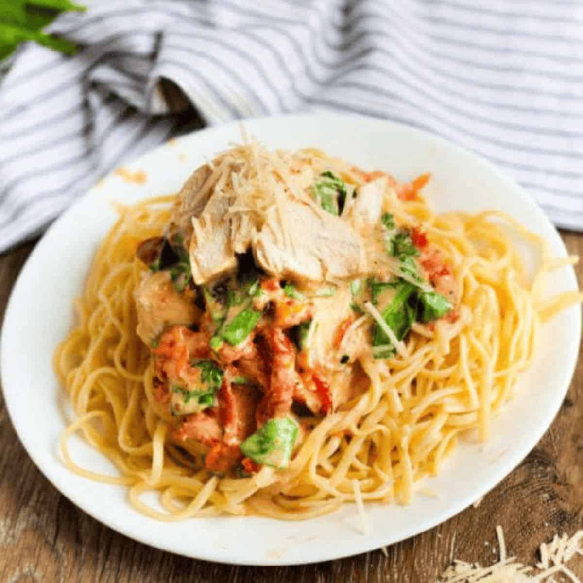 A scrumptious dinner featuring crockpot creamy tuscan chicken.