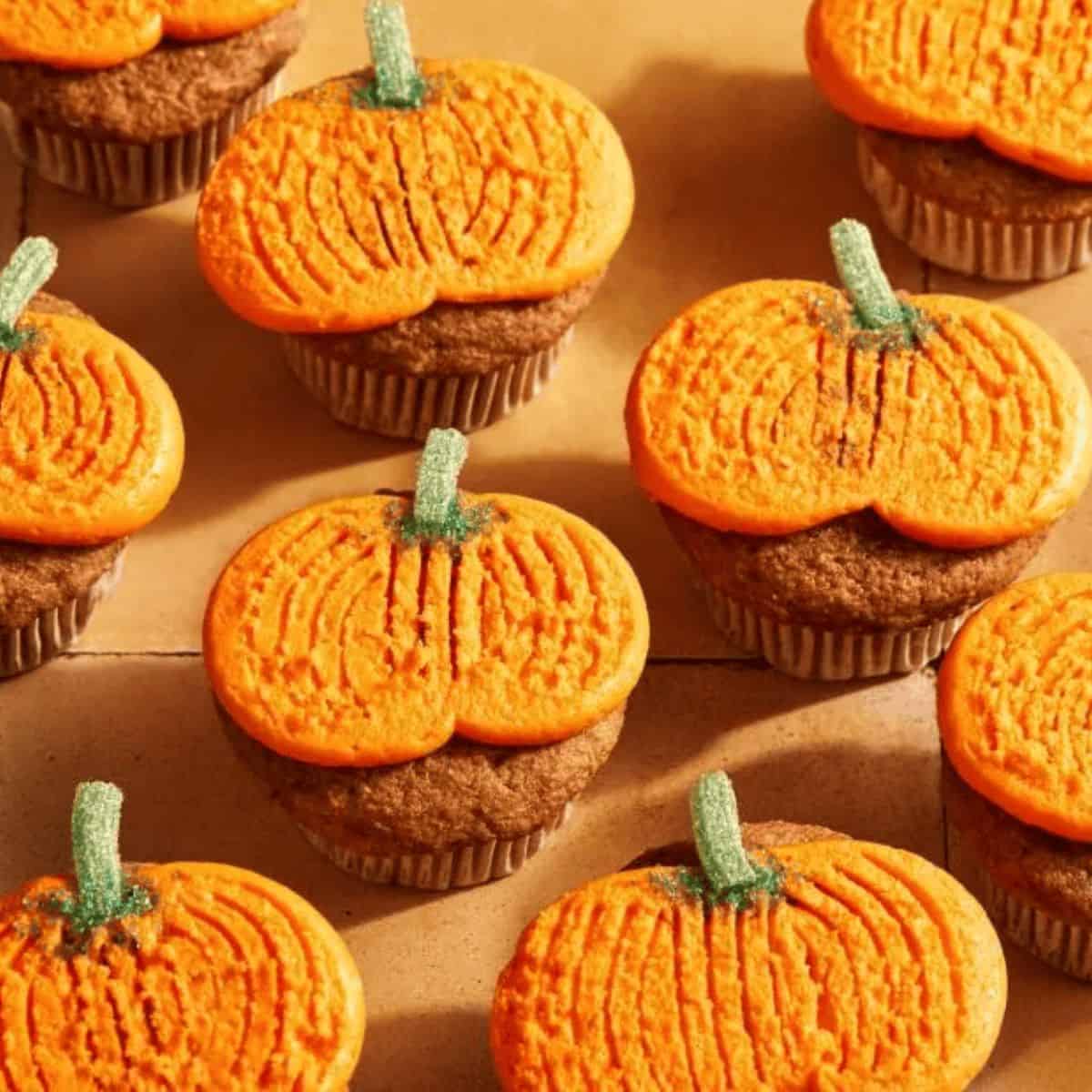 A spooky delight with Halloween flat frosting pumpkin cupcakes.
