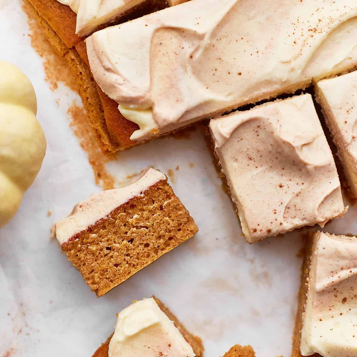A yummy treat with pumpkin cake with cream cheese frosting.