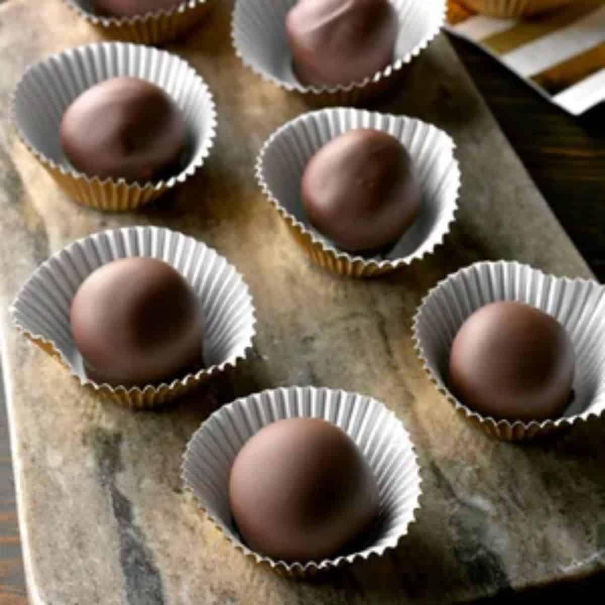 The perfect addition to your fall dessert menu with dark chocolate pumpkin truffles.