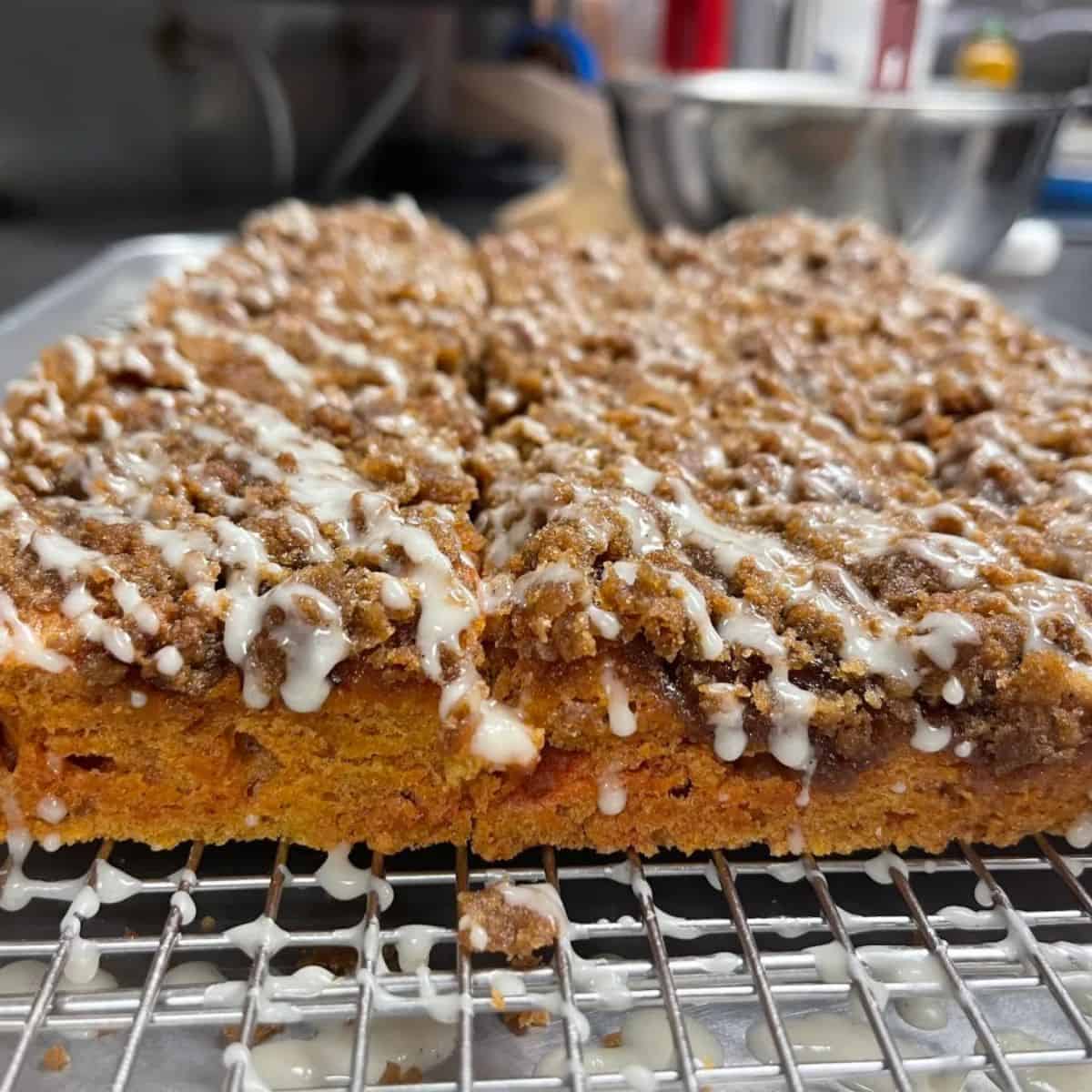 A yummy and scrumptious treat featuring pumpkin spice coffee cake with streusel topping.