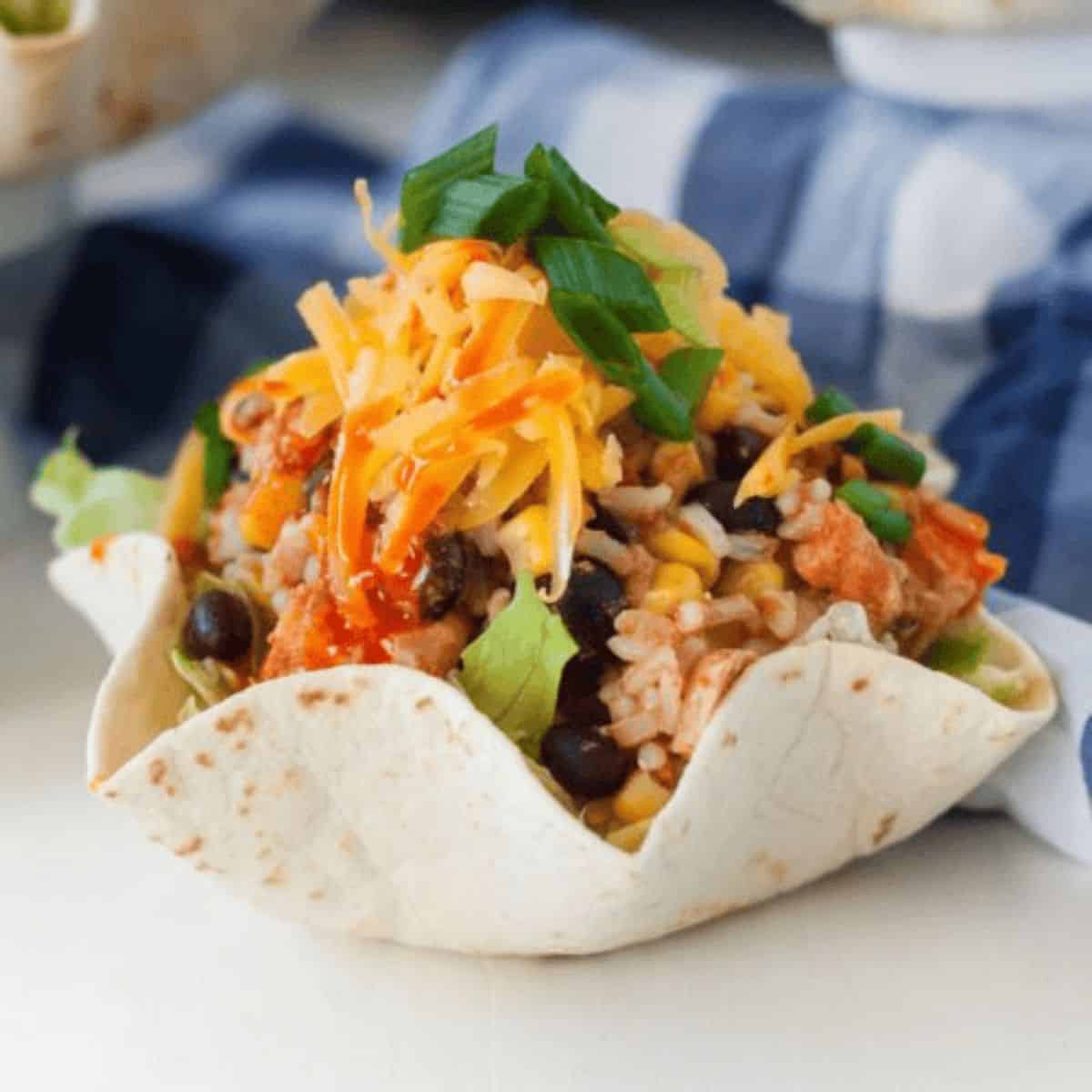 A yummy dinner with slow cooker chicken burrito bowl recipe.