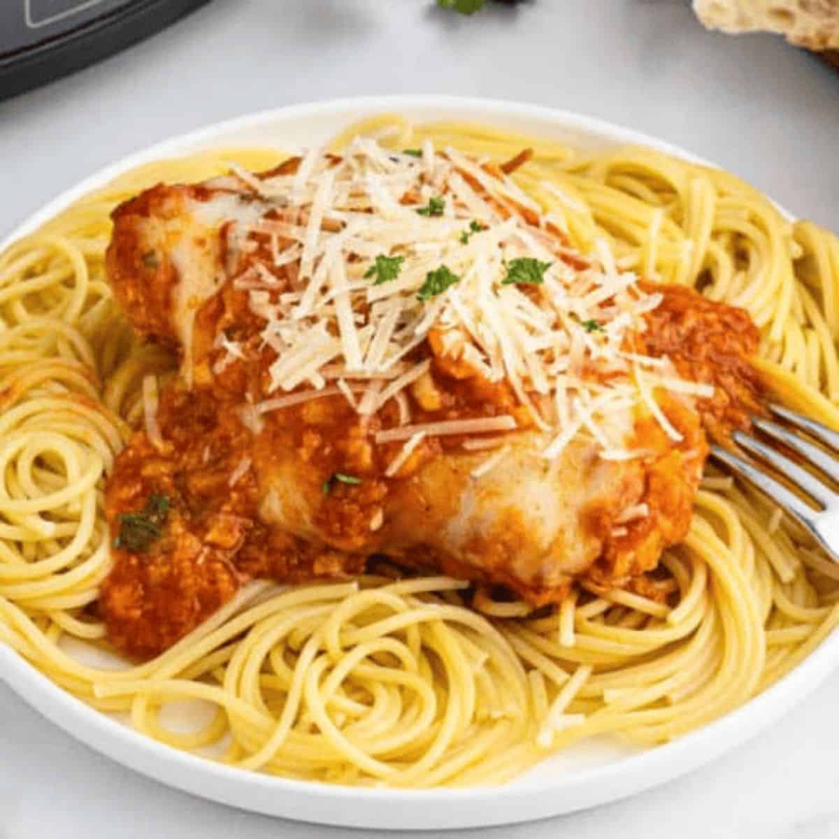A yummy dinner with slow cooker chicken parmesan.
