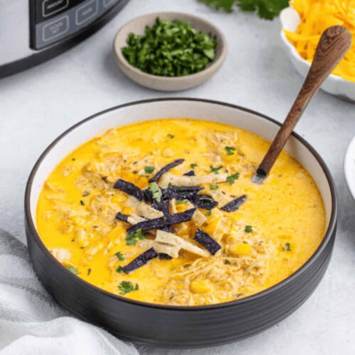 A yummy dinner with slow cooker creamy chicken tortilla soup.