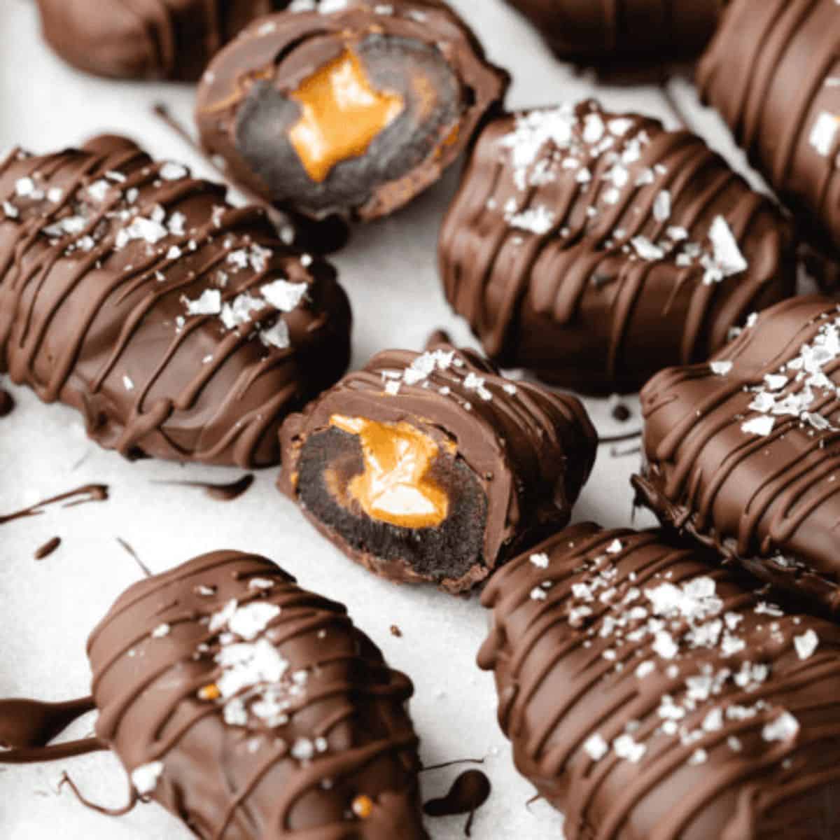 A scrumptious treat with chocolate covered dates with peanut butter.