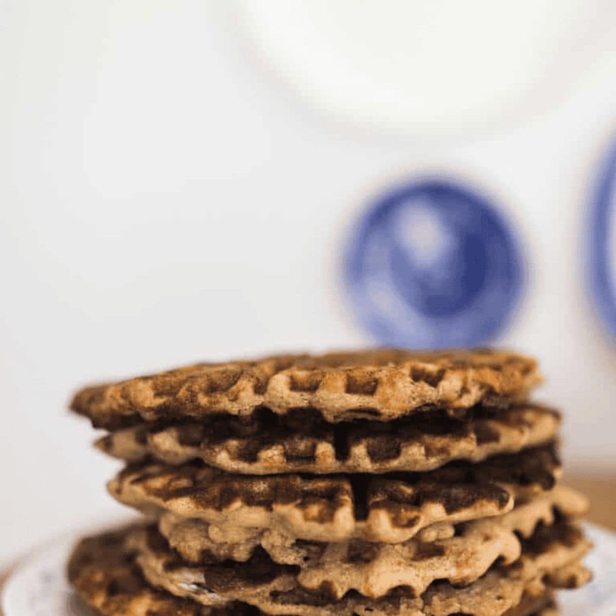 A crunchy treat with crispy sourdough waffles stacked over each other.