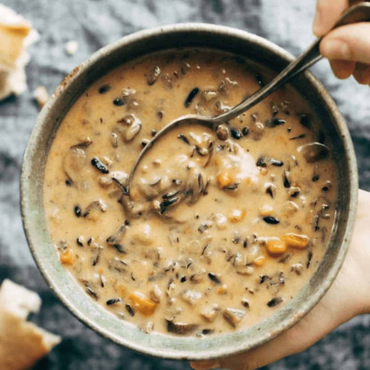 A delicious Instant Pot wild rice soup with delicious veggies in a soup bowl.