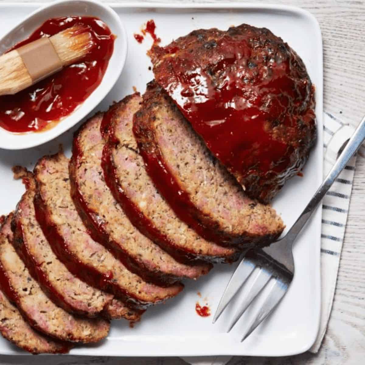 An appetizing meal featuring mushroom and provolone meatloaf.