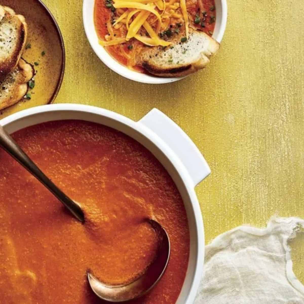 A warm and comforting dish featuring roasted tomato soup with cheddar cheese. 