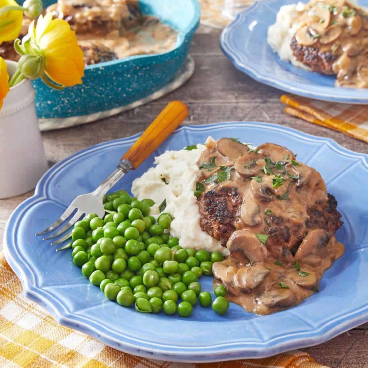 A delicious meal featuring salisbury steak. 