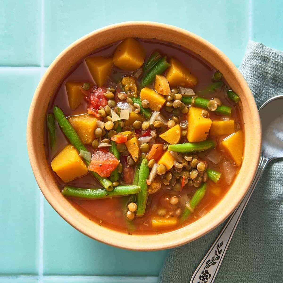 A warm and comforting dish featuring spicy veggie and lentil soup. 