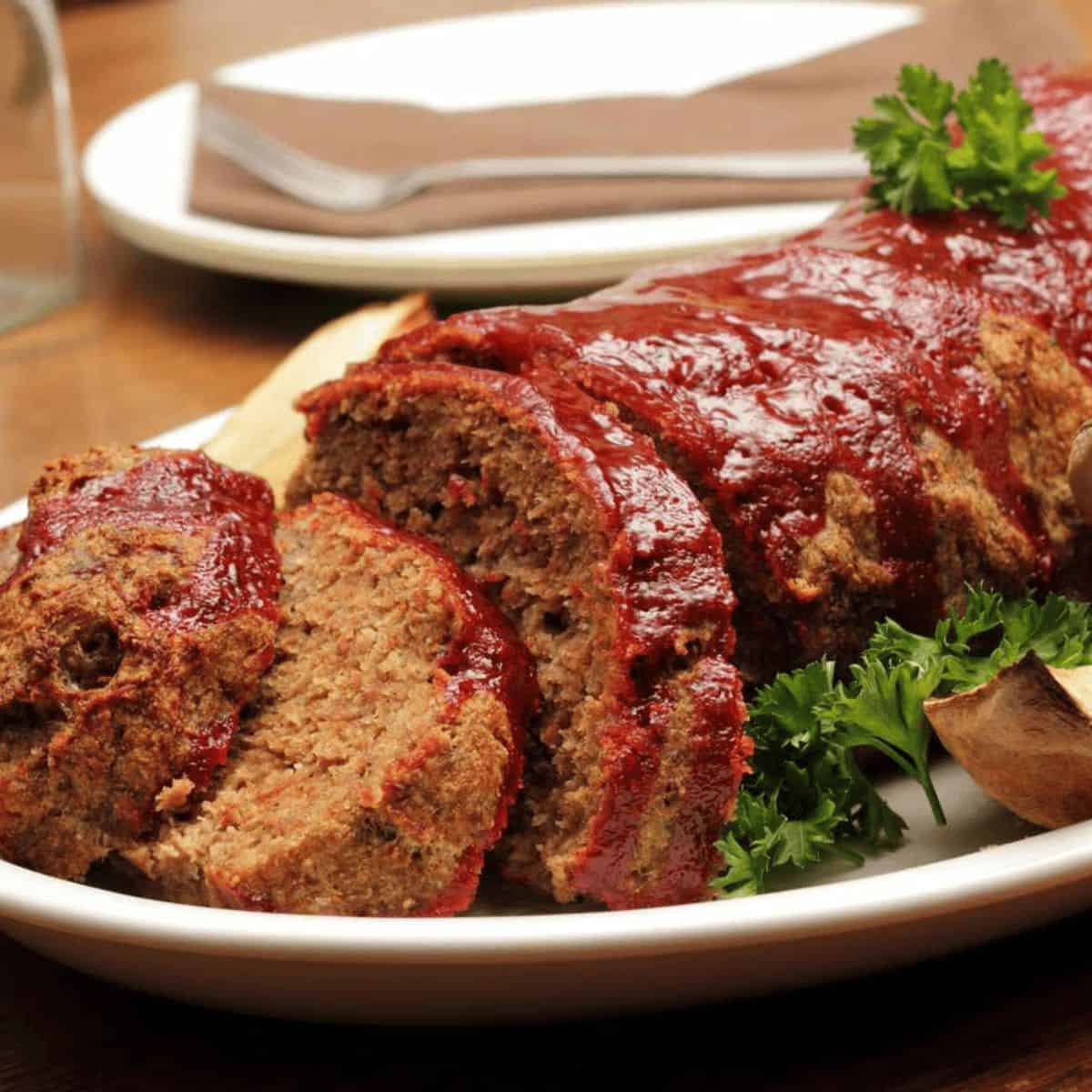 A devouring meal with stuffing meatloaf with marmalade glaze and arugula salad.