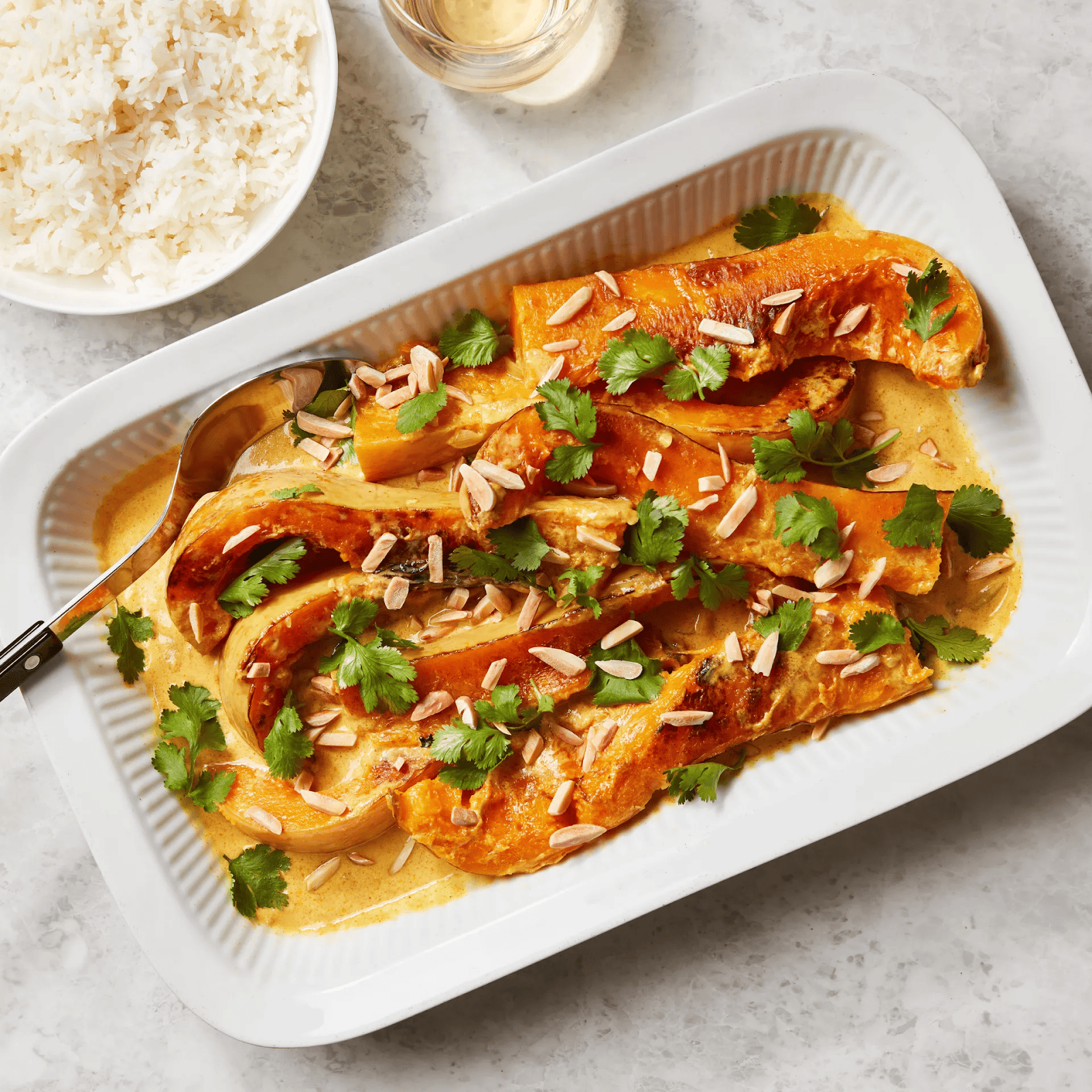 A delicious butternut squash recipe featuring braised butternut squash in spiced coconut gravy.