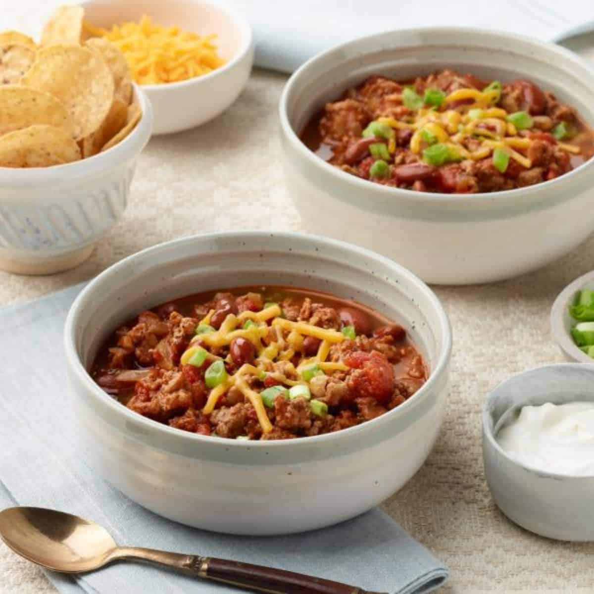 A steaming bowl of 30-Minute Turkey Chili, filled with lean ground turkey, beans, and spices, perfect for a quick, flavorful meal.
