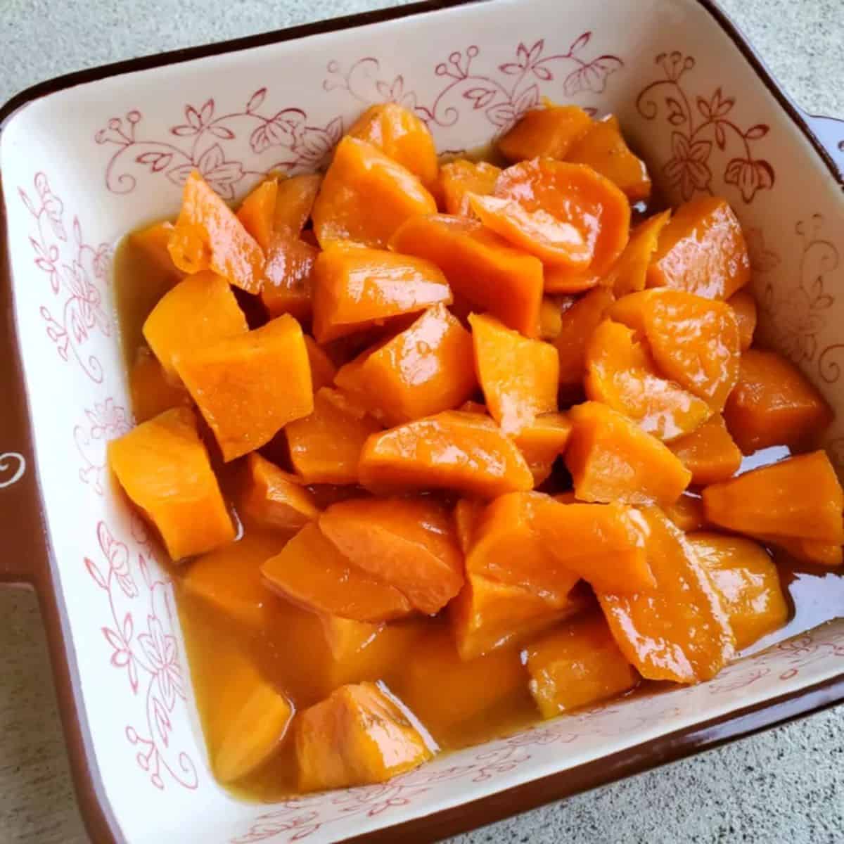 A sweet delight with candied sweet potatoes with orange juice.