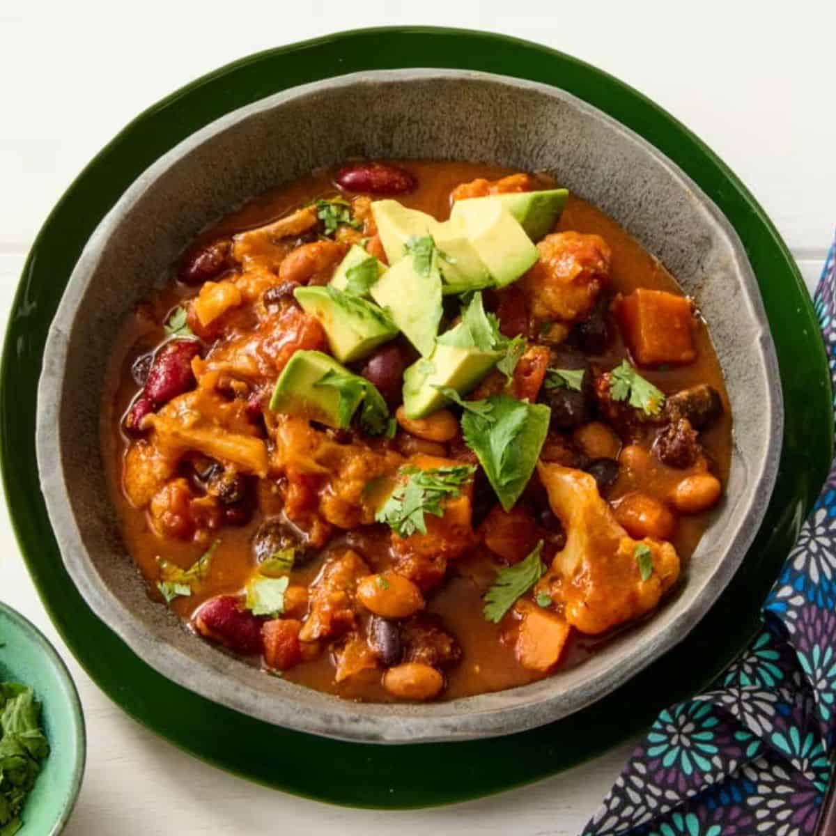 A flavorful bowl of Cauliflower Chili, featuring tender cauliflower, beans, and spices in a rich, savory broth.
